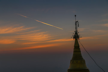 Sunset with mountains in the background the stupa of Myanmar