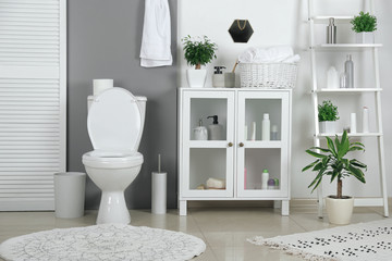 Stylish toilet bowl in modern bathroom interior