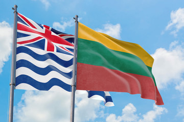 Lithuania and British Indian Ocean Territory flags waving in the wind against white cloudy blue sky together. Diplomacy concept, international relations.