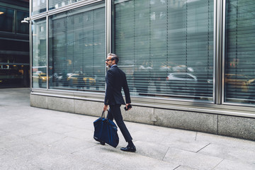 Businessman walking down street