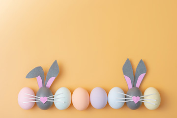 Cute creative photo with easter eggs, some eggs like easter bunny