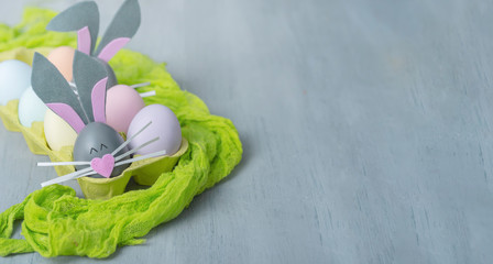Cute creative photo with easter eggs, some eggs like easter bunny