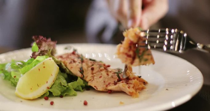 Men's hands with a fork and knife.
