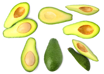 Set of delicious fresh avocados on white background