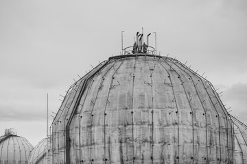 Fototapeta premium Details of old gas tank of spherical form, black and white.