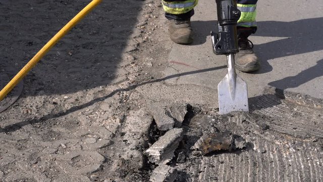 Construction Road Works With Jack Hammer - Zoom Out Shot