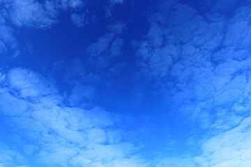Blue sky with nice weather clouds 