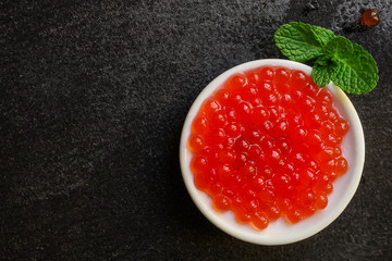 red caviar (seafood, salmon caviar) menu concept. food background. top view. copy space