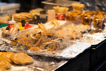 Korean traditional food, Japchae fresh cooked on a pan. Korean stir fry noodle on a food stall in Myeongdong, South Korea.