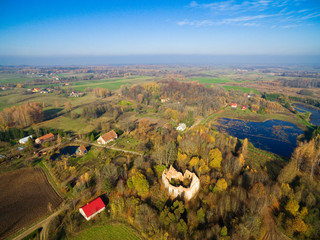 Ruins of cross shaped Lutheran church in autumn scenery, Gorne, Poland (former Gurnen, East Prussia)