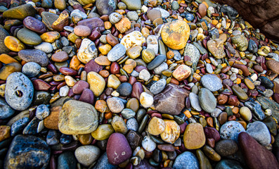 Different coloured stones on a beach