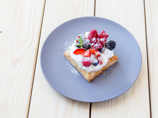 Homemade Italian Dessert with Cream and Berries on the Wooden Background