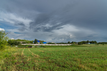 Beautiful summer rural landscape with cloudy sky