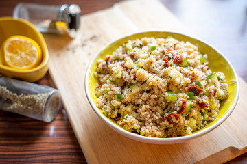 Healthy Salad with Barley, Sun Dried Tomatoes, Cucumber, Lemon Juice, Olive Oil and Herbs
