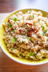 Healthy Salad with Barley, Sun Dried Tomatoes, Cucumber, Lemon Juice, Olive Oil and Herbs