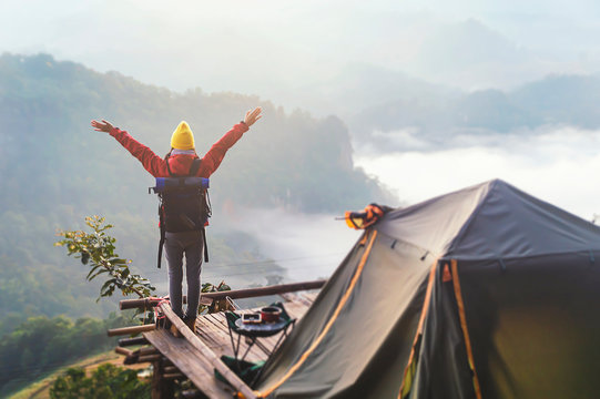Hipster young girl with bright backpack of amazing landscape sunset on vintage on peak mountain mockup.