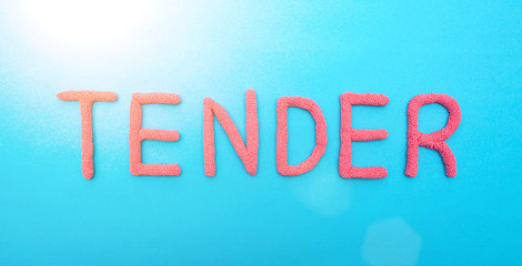 Fototapeta premium The word tender in red letters on a blue background. The concept of competitive procurement from a good specialist, market