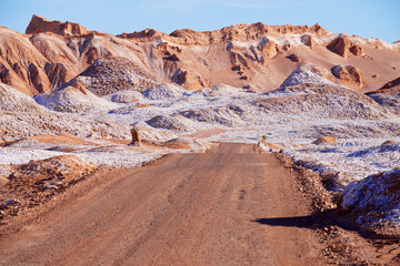 Dirt road in the Moon valley in Atacama desert near San Pedro de Atacama, Chile.