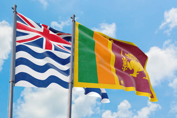 Sri Lanka and British Indian Ocean Territory flags waving in the wind against white cloudy blue sky together. Diplomacy concept, international relations.