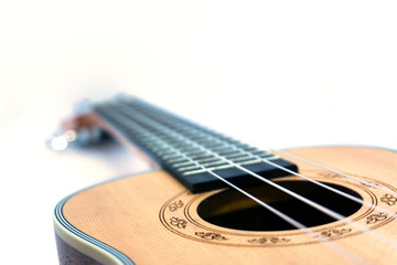 Obraz premium Brown ukulele hawaiian guitar isolated on white background