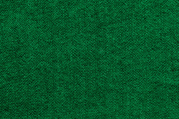 Green knitted wool fabric texture background
