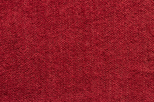 Red Knit Fabric Background. Colorful Wool Sweater Texture