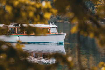 Boat on the lake in autumn with leaves