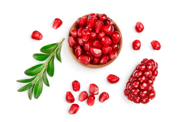 pomegranate seeds in wooden bowl isolated on white background with clipping path and full depth of...