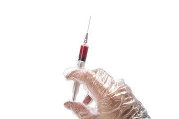 the hand holds a disposable sterile syringe filled with blood on a white isolated background