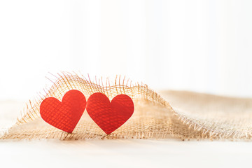 Two red heart with sack  cloth for Valentine's day