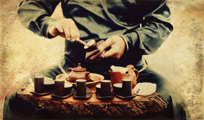Tea ritual. Old photos effect with border.