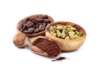 Coffee beans with cardamom  isolated on white background. Coffee beans with spice.