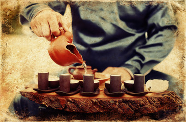 Tea ritual. Old photos effect with border.