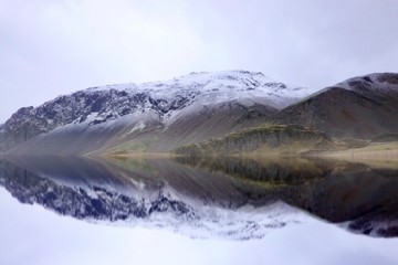 Beautiful scenery Vestrahorn, Iceland with smooth reflection and glacier on the linear of mountains.