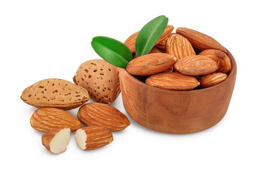 Almonds nuts with leaves in wooden bowl isolated on white background with clipping path and full depth of field.