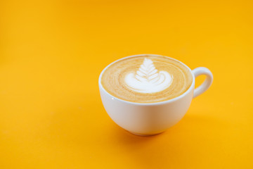 Cup of fresh coffee on blue background, top view