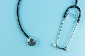 Stethoscope on blue background.  Healthcare and Health Insurance concept