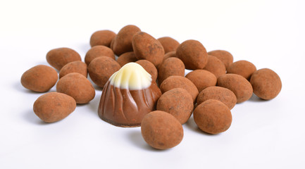 Sweets with almonds and cocoa powder. Isolated On white background