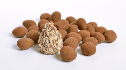 Sweets with almonds and cocoa powder. Isolated On white background