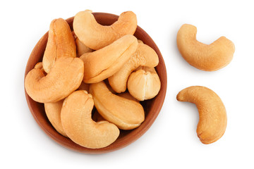 Roasted Cashew nuts in wooden bowl isolated on white background with clipping path and full depth of field. Top view. Flat lay