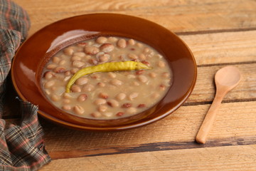 plate of red beans with chili pepper, typical Spanish dish