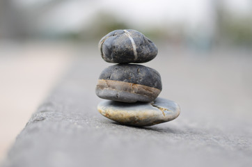 Small stones stacked on the background of virtualization