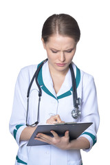 Portrait of female thinking doctor posing on white