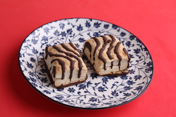 small chocolate cakes in color background