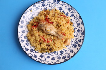plate of rice with chicken and peppers