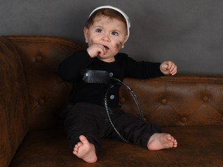 portrait of a little boy in a chimney-sweep costume