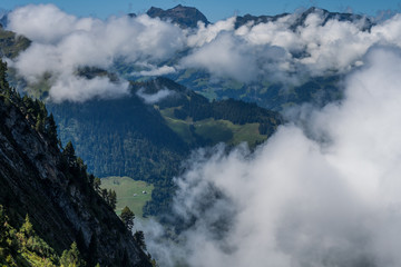 Beautiful swiss alps mountains.    Clouds 