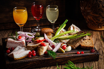 European cuisine in Ukrainian style. Meat set of homemade sausage, lard and bread. Serving dishes...