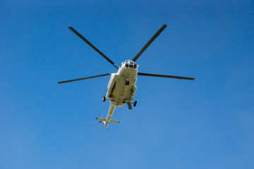 Fototapeta premium Big white Russian helicopter in the blue sky.