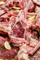 Raw Meat Marinated Lamb Chops on Tray / Marinating Before Cooking.